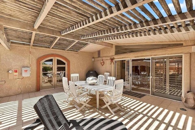 view of patio / terrace featuring french doors and a pergola