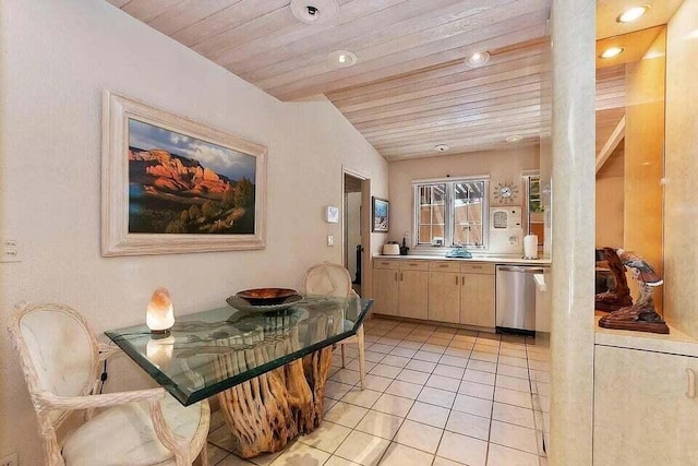 kitchen with cream cabinets, ornate columns, wood ceiling, stainless steel dishwasher, and light tile patterned flooring