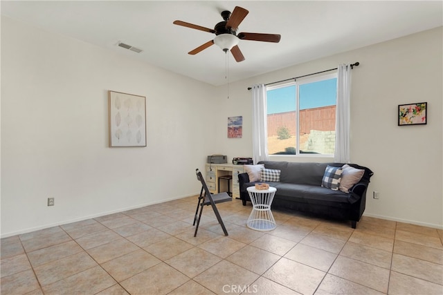 interior space featuring light tile patterned flooring and ceiling fan