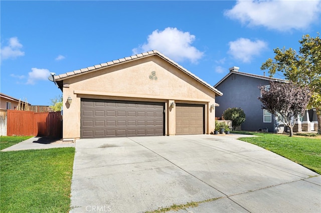 view of front of property with a garage and a front lawn