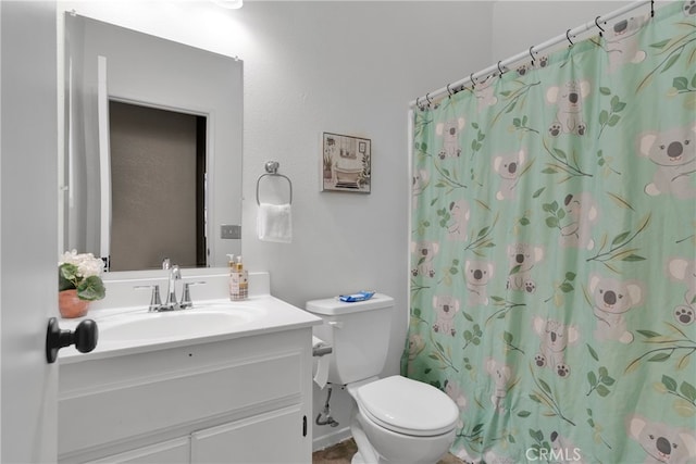 bathroom with vanity, a shower with curtain, and toilet