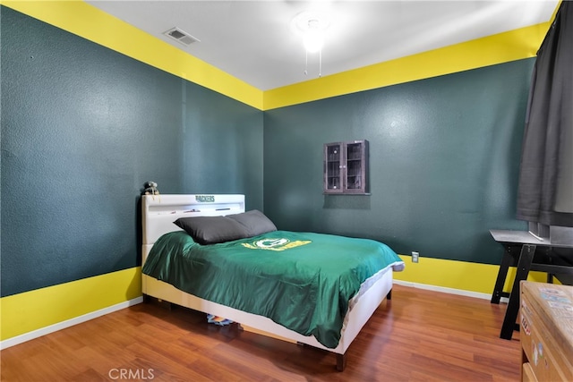 bedroom featuring hardwood / wood-style flooring