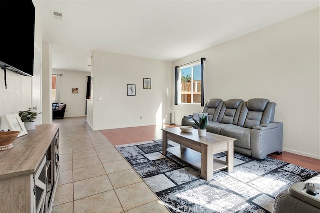 living room with light tile patterned flooring