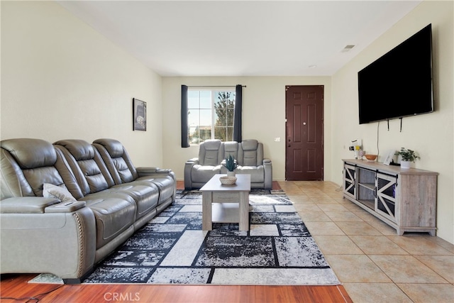 living room with light tile patterned floors