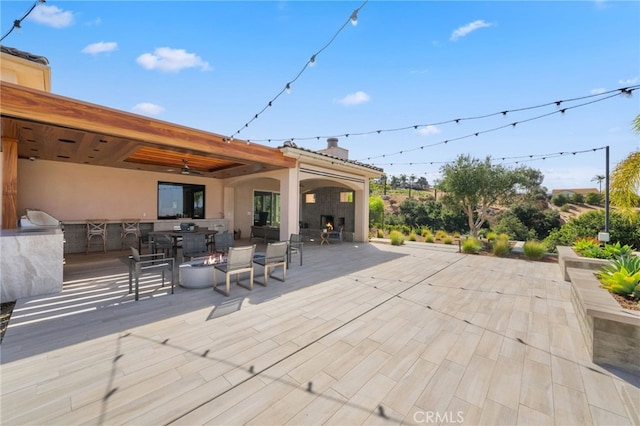 deck featuring a patio area and ceiling fan