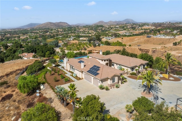 drone / aerial view featuring a mountain view