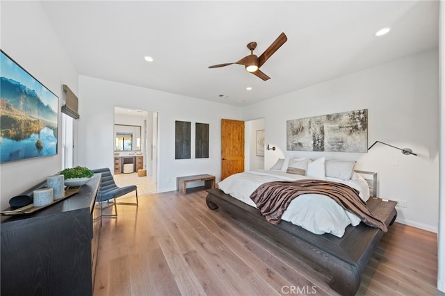 bedroom with ceiling fan and light wood-type flooring