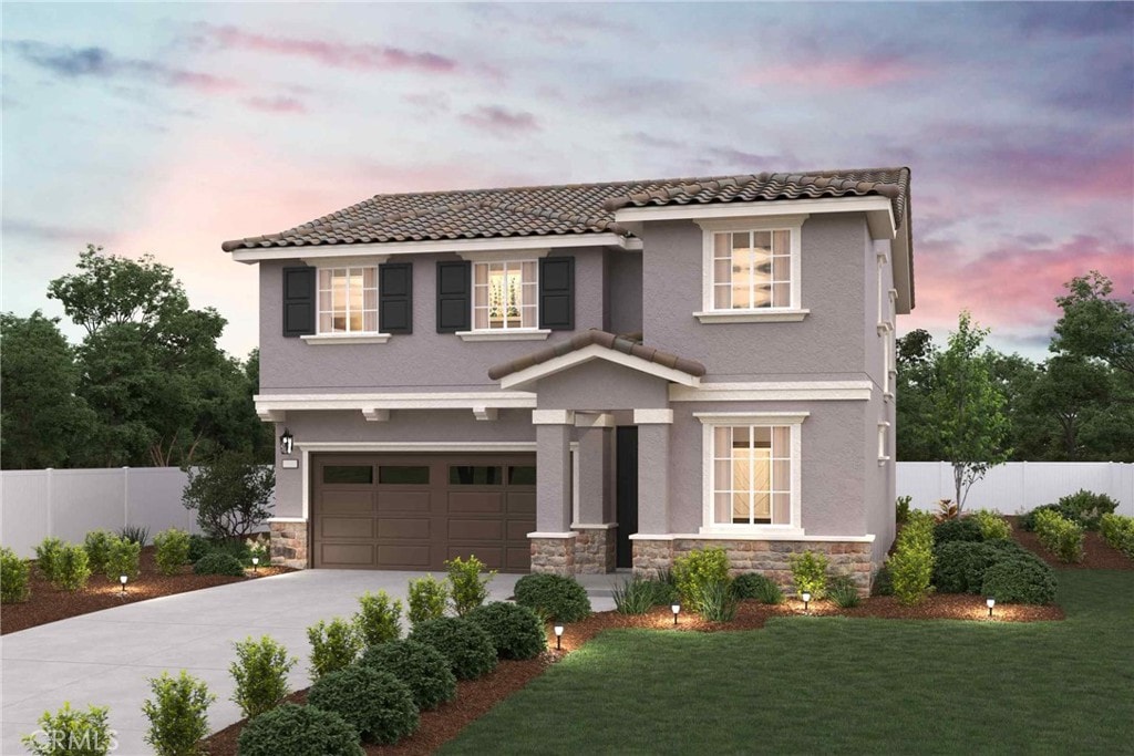 view of front of home featuring a yard and a garage