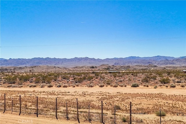 view of mountain feature with a rural view