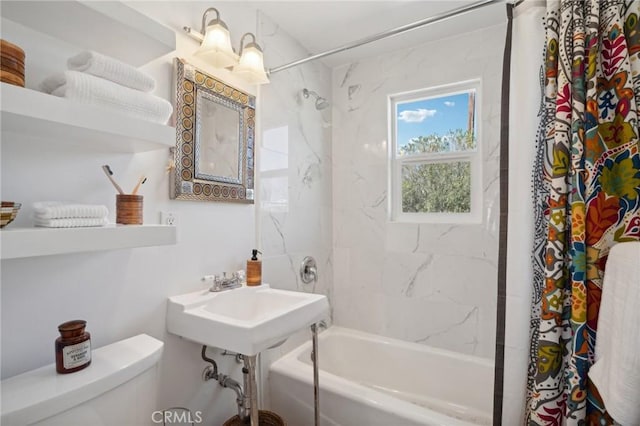 full bathroom with toilet, sink, and shower / bath combo with shower curtain