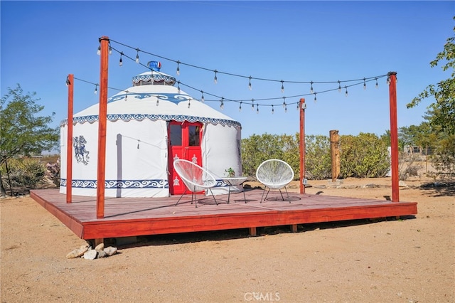 exterior space featuring a gazebo and a wooden deck