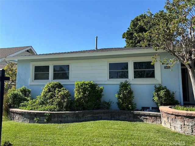 view of home's exterior featuring a lawn