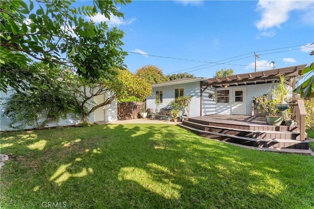 view of yard featuring a deck and a pergola