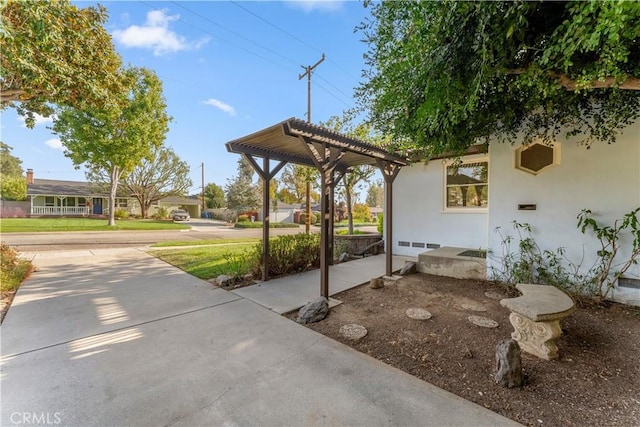 exterior space with a pergola