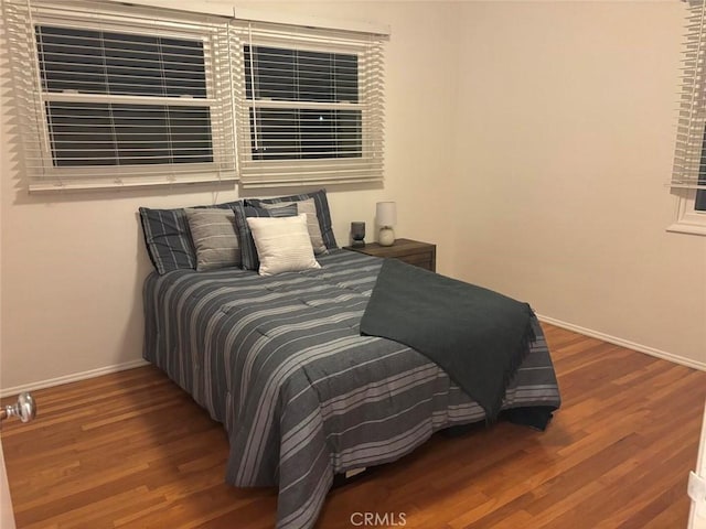 bedroom with hardwood / wood-style floors