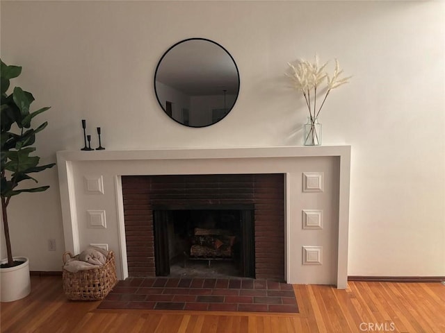 room details featuring wood-type flooring and a fireplace