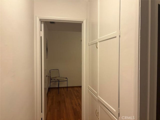 hallway featuring dark hardwood / wood-style floors