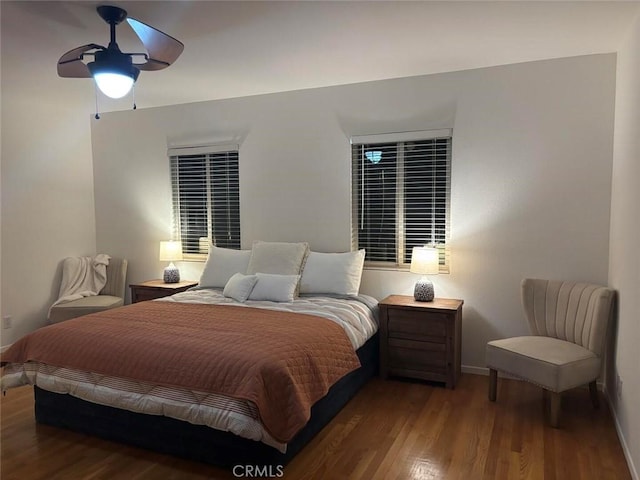 bedroom featuring ceiling fan and hardwood / wood-style flooring