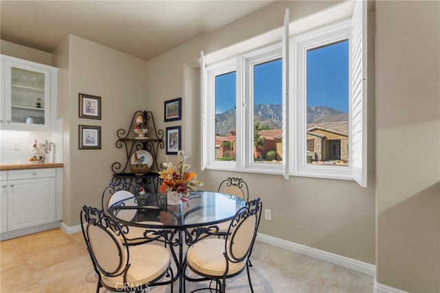 tiled dining space with a mountain view