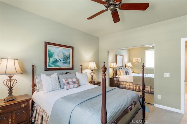 bedroom featuring ceiling fan and light carpet