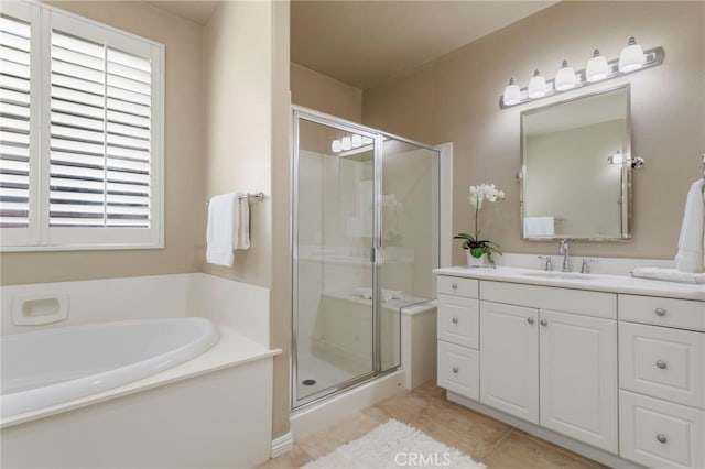 bathroom featuring separate shower and tub, vanity, and tile patterned floors