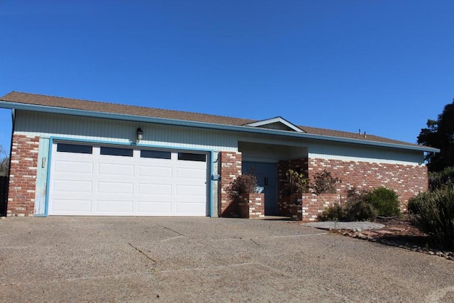 ranch-style home featuring a garage