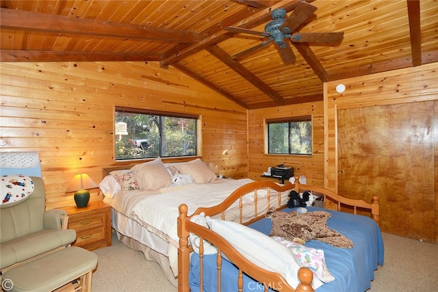 carpeted bedroom with wood walls, lofted ceiling with beams, wooden ceiling, and ceiling fan