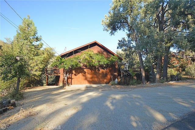 view of side of property featuring a garage