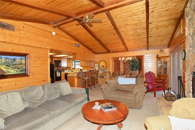 carpeted living room featuring wood ceiling, wood walls, and beamed ceiling