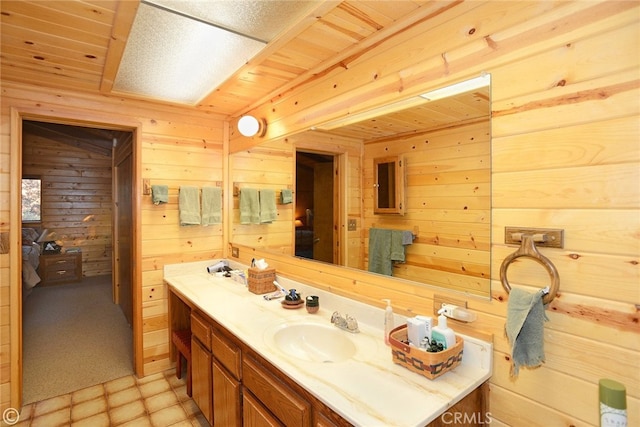 2428 Innsbruck Ct, Pine Mountain Club, CA 93222 - bathroom featuring wooden ceiling, wood walls, and vanity