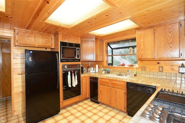 2428 Innsbruck Ct, Pine Mountain Club, CA 93222 - kitchen featuring black appliances, wooden ceiling, light flooring, and tile counters