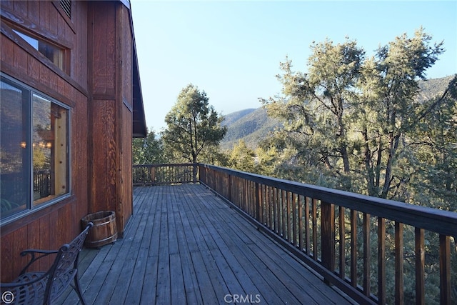 wooden deck with a mountain view