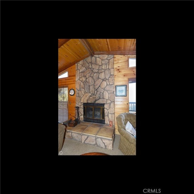 2428 Innsbruck Ct, Pine Mountain Club, CA 93222 - living area featuring wooden walls, wood ceiling, vaulted ceiling, and a fireplace