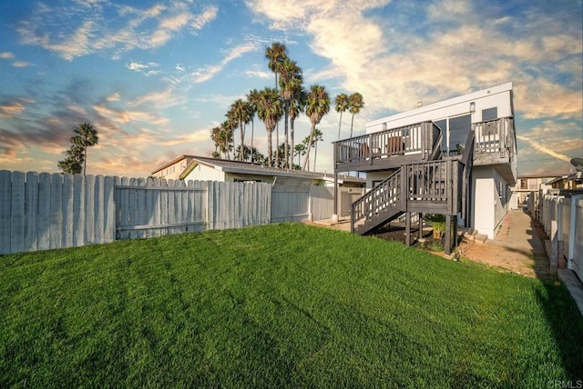 yard at dusk with a deck