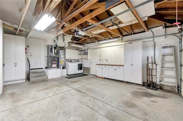 garage featuring a garage door opener, water heater, heating unit, and washing machine and dryer