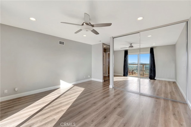 interior space featuring light hardwood / wood-style floors and ceiling fan