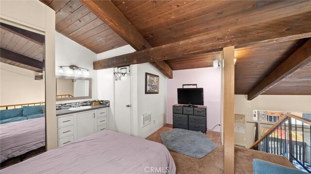 bedroom with lofted ceiling with beams and wooden ceiling