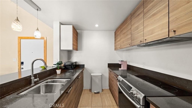 kitchen featuring sink, light tile patterned floors, hanging light fixtures, and stainless steel electric range oven