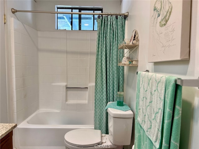 full bathroom featuring toilet, vanity, and shower / bathtub combination with curtain