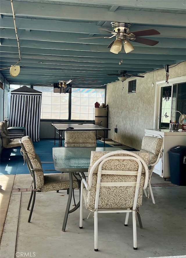 view of patio featuring ceiling fan