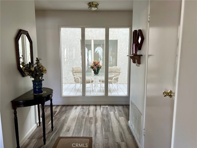 doorway to outside with light hardwood / wood-style floors