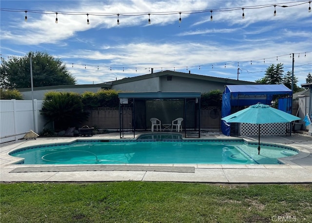 view of swimming pool featuring a gazebo, a yard, and a patio