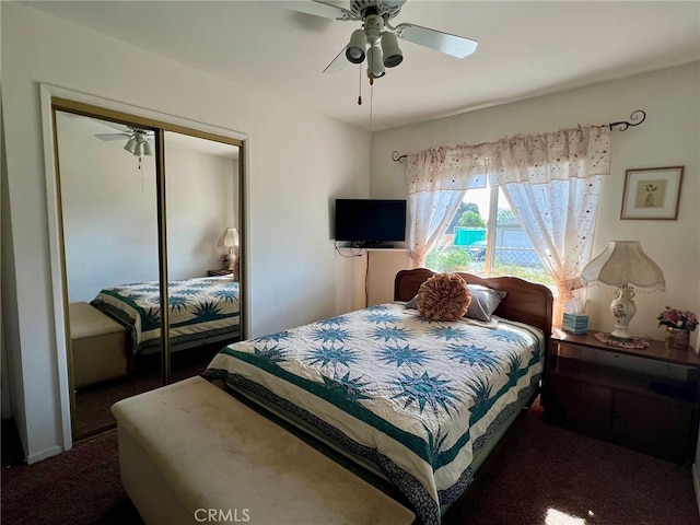 carpeted bedroom with a closet and ceiling fan