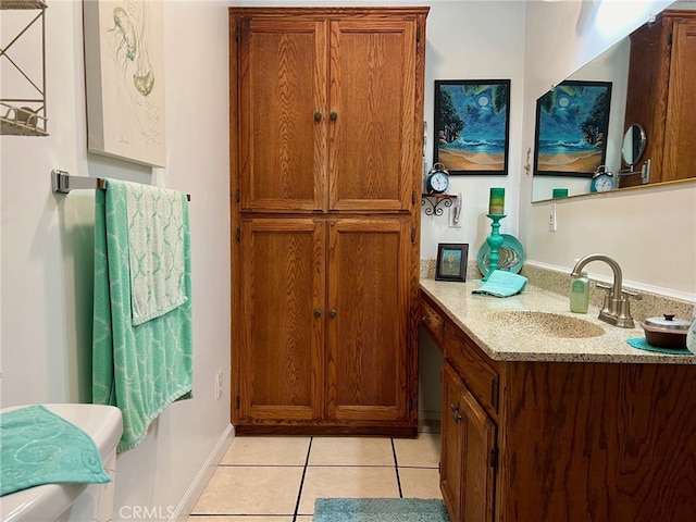 bathroom featuring vanity, toilet, and tile patterned flooring