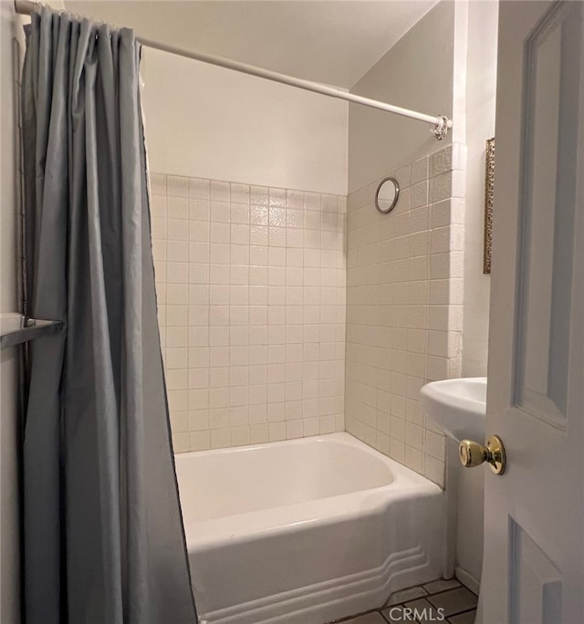 bathroom featuring shower / tub combo with curtain and tile patterned flooring