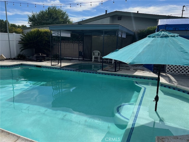 view of swimming pool with a patio area