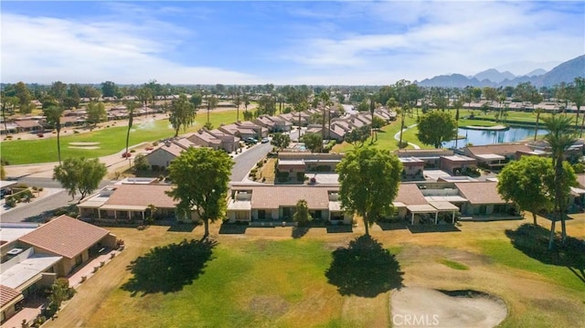 drone / aerial view featuring a water and mountain view