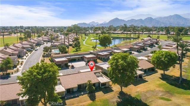 birds eye view of property featuring a water and mountain view