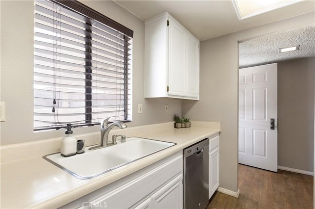 kitchen with white cabinetry, dishwasher, sink, dark hardwood / wood-style flooring, and a textured ceiling