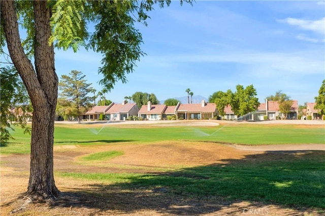 surrounding community featuring a yard